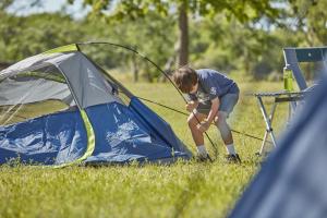 Cub Scouts Camping setting up tent